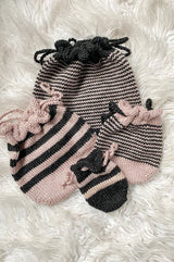 Four knit bags scattered on white background thumbnail