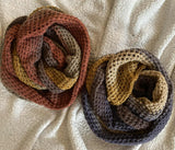 Two crochet cowls on fleece blanket thumbnail