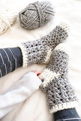 Close up on crochet socks with textured cuffs. thumbnail