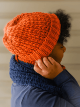 Close up of textured orange hat with folded brim. thumbnail