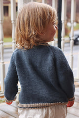 Back view of toddler, showing denim blue cardigan. thumbnail