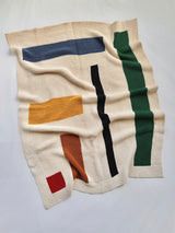 Knit baby blanket laid flat on white background. thumbnail