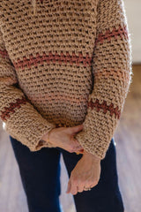 Close up of lower part of sweater, showing ribbed hems and cuffs. thumbnail