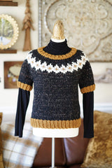Full view of short sleeve sweater work over black turtleneck, on dress form. thumbnail