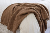 Full view of warm brown blanket draped over foot of bed. thumbnail