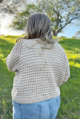 Back view of crochet mesh pullover. thumbnail