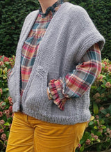 Close front view of cardigan vest, showing drop shoulder style, rib details, and front pocket. thumbnail