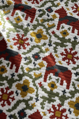 Close up of all over tapestry style motif of horses, flowers, and vines on white background. thumbnail