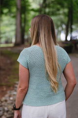 Back view of crochet top, with short sleeves and scoop neck. thumbnail