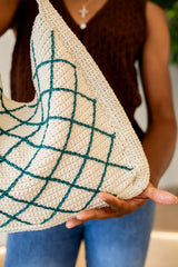 Close up of bottom corner of bag, showing side gusset panel and diamond overlay detail. thumbnail