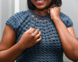 Cropped front view of crochet top showing lacy texture and high crew neck. thumbnail