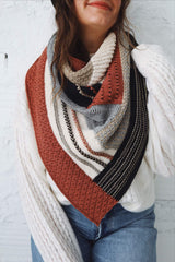 Cropped front view of large triangular shawl worn bandana style. thumbnail