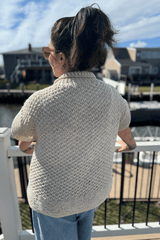 Back view of sweater, showing all-over texture on body and wide lower hem. thumbnail