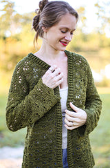 Cropped front view of crochet lacy cardigan, with an open front and slightly belled sleeves. thumbnail
