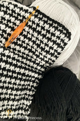 Crochet Throw Beside A Yarn thumbnail