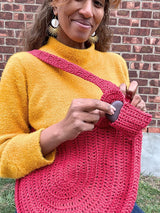 woman holding crochet bag thumbnail