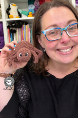 woman holding brown handmade plush yarn spider with eyes thumbnail