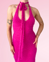 Woman wearing hot pink dress made with fuzzy yarn on pink background thumbnail