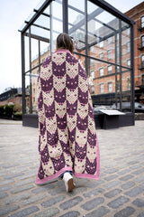 woman wrapped in cat face blanket thumbnail