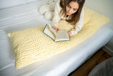 girl reading on body pillow thumbnail
