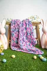 knit blanket in an easter scene with bunnies and eggs thumbnail