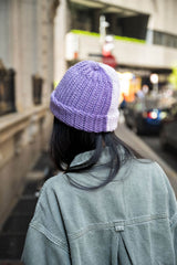 woman wearing hat, shown from the back. thumbnail