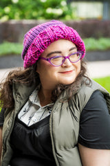 woman wearing knit hat in pink and purple thumbnail