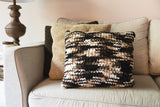 self striping pillow on a couch thumbnail