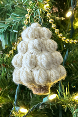 handmade bobble stitch Christmas tree ornament hanging on a tree thumbnail