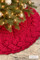 close up of handmade red and white cable braid crochet Christmas tree skirt thumbnail