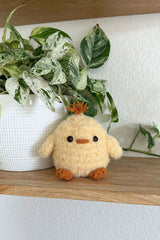 Fluffy chick stuffed animal on a shelf thumbnail