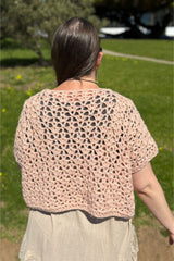 woman wearing a pink crocheted willow top outdoors thumbnail