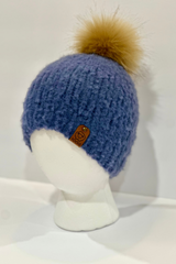 blue knit beanie with a fluffy faux-fur pom-pom and branded side tag thumbnail