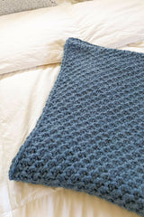 Crochet Blanket On A Bed thumbnail