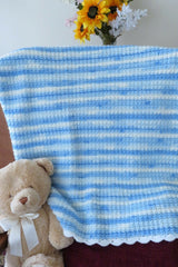 Crochet Blanket Beside A Teddy Bear thumbnail