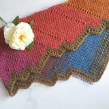 scarf on marble background with flower on top thumbnail