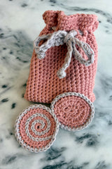 Crocheted face rounds with bag on counter thumbnail