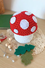 handmade crochet mushroom on a wooden table thumbnail