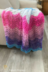 colorful blanket draped over couch thumbnail