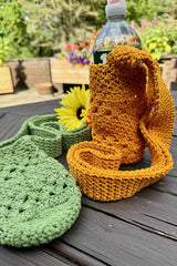 Crochet Water Bottle Holder On The Table thumbnail