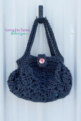 dark blue crocheted hobo handbag with a button closure thumbnail