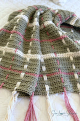 crocheted sage green tartan plaid throw blanket featuring cream and rose woven vertical stripes and fringe tassel ends thumbnail