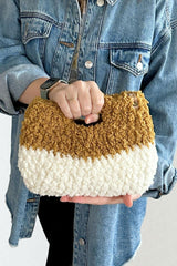 woman holding two tone sherpa bag thumbnail