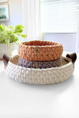 crochet baskets on a table, one with lemons in it thumbnail