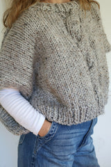 Knitted Poncho Worn By A Woman thumbnail