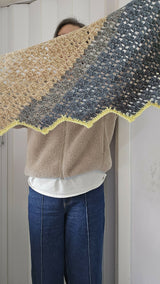 Black Crochet Scarf Held By A Woman thumbnail