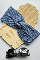 blue crocheted headband styled on a wooden display with sunglasses thumbnail