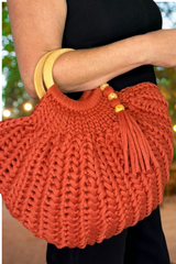 purse on womans arm thumbnail