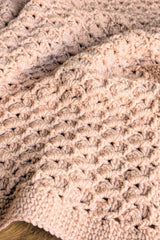 close-up of pink crochet blanket thumbnail