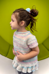 Little girl in knit top playing thumbnail